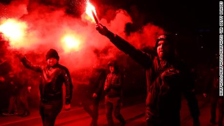 People attend &#39;White-and-red independence march&#39; to celebrate the 100th anniversary of Poland regaining independence. Warsaw, Poland on 11 November, 2018. More than 200,000 participant walked through the streets of Warsaw in the march organised by the government after the same event organized by extreme right wing associations was banned. (Photo by Beata Zawrzel/NurPhoto via Getty Images)